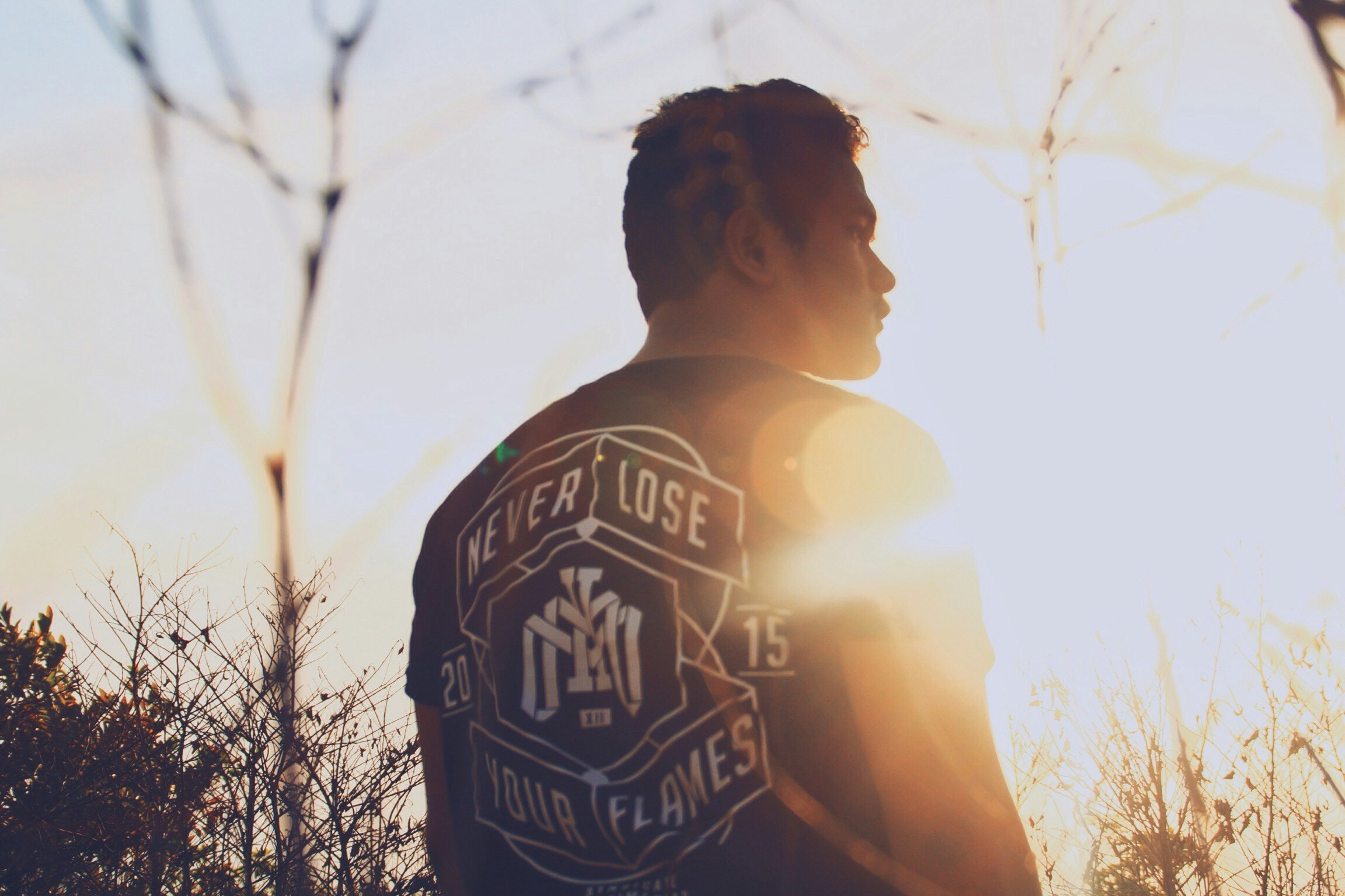 man standing near trees during daytime